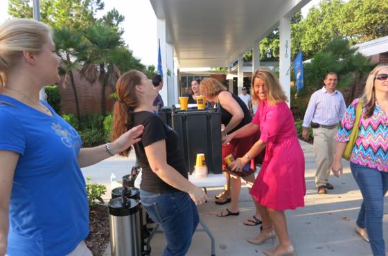 PTA serving coffee in front of the school